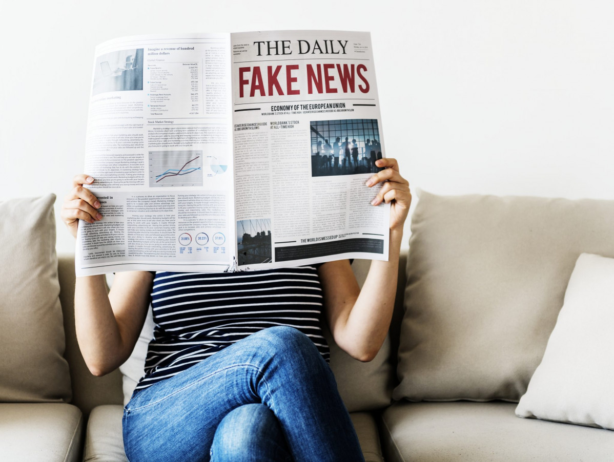 Woman reading newspaper 2048x1541